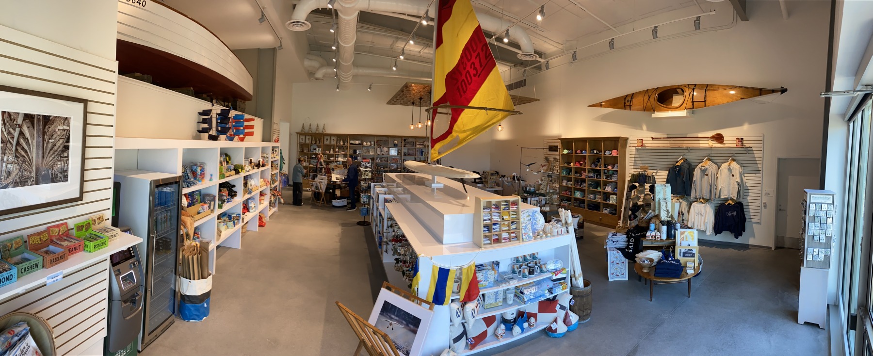 Completed museum store with custom boat-hull retail counter and display millwork by SMFW