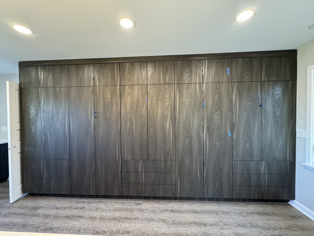 Gray ash wardrobe wall with fitted interiors built by SMFW