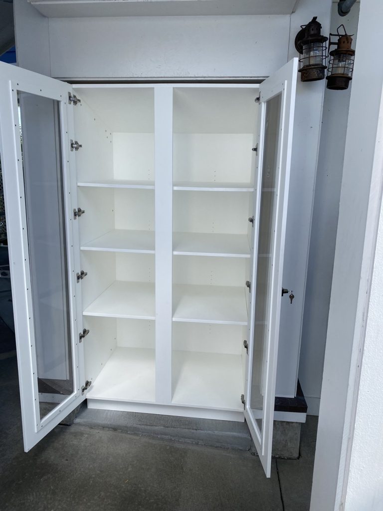 HDPE outdoor display cabinet with adjustable shelving and stainless hardware, doors open