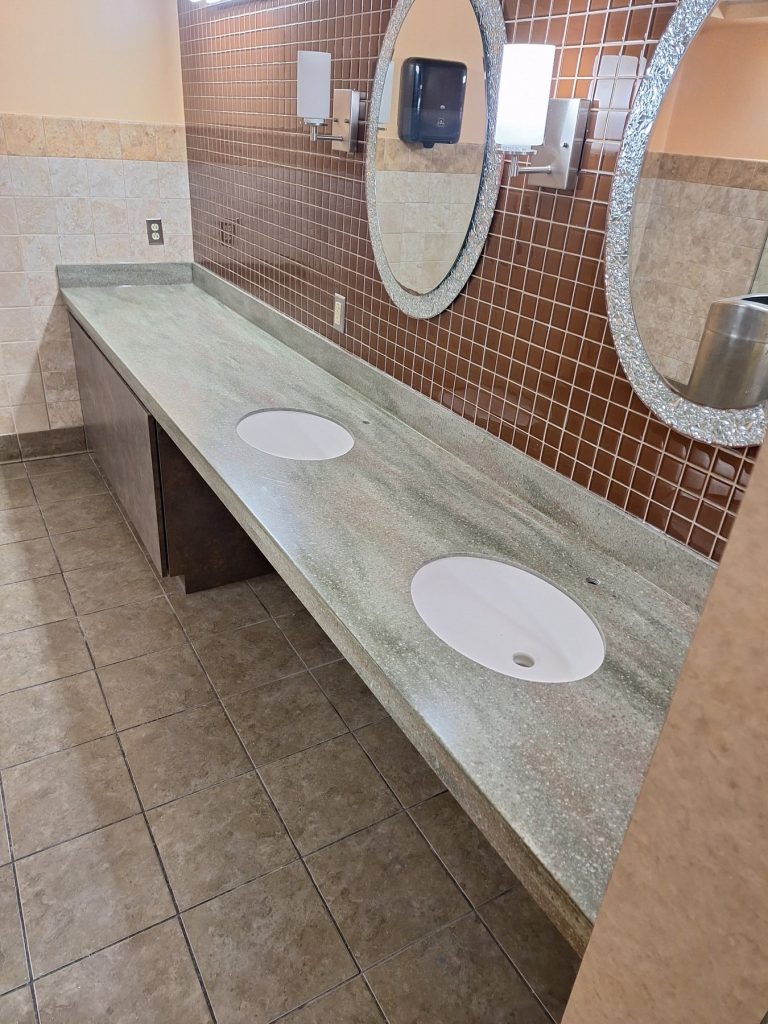 ADA-compliant vanity with Corian top and undermount bowls at a Washington DC military installation