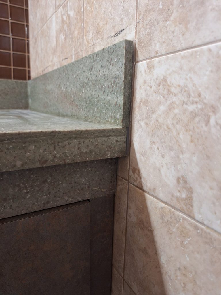 Corian backsplash and edge detail on ADA vanity top