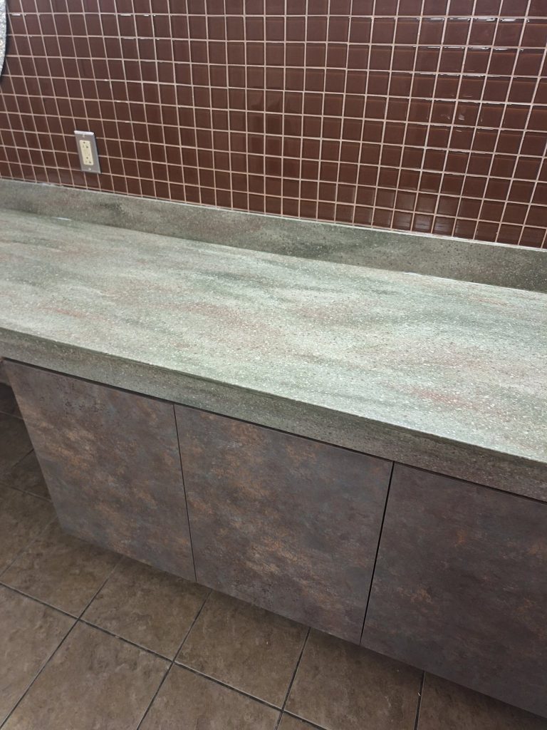 Vanity run with shop-pressed Formica laminate storage cabinet and Corian top