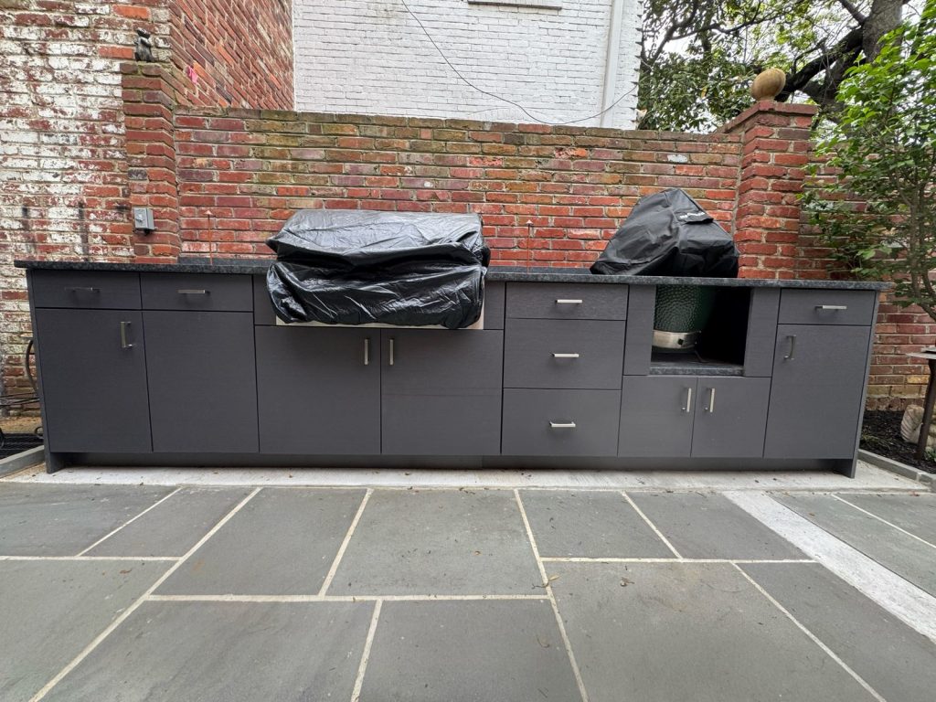 Courtyard run of weather-rated outdoor cabinetry built by SMFW