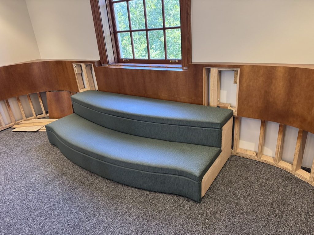 First upholstered cushions installed on reading center millwork at the Petworth Neighborhood Library