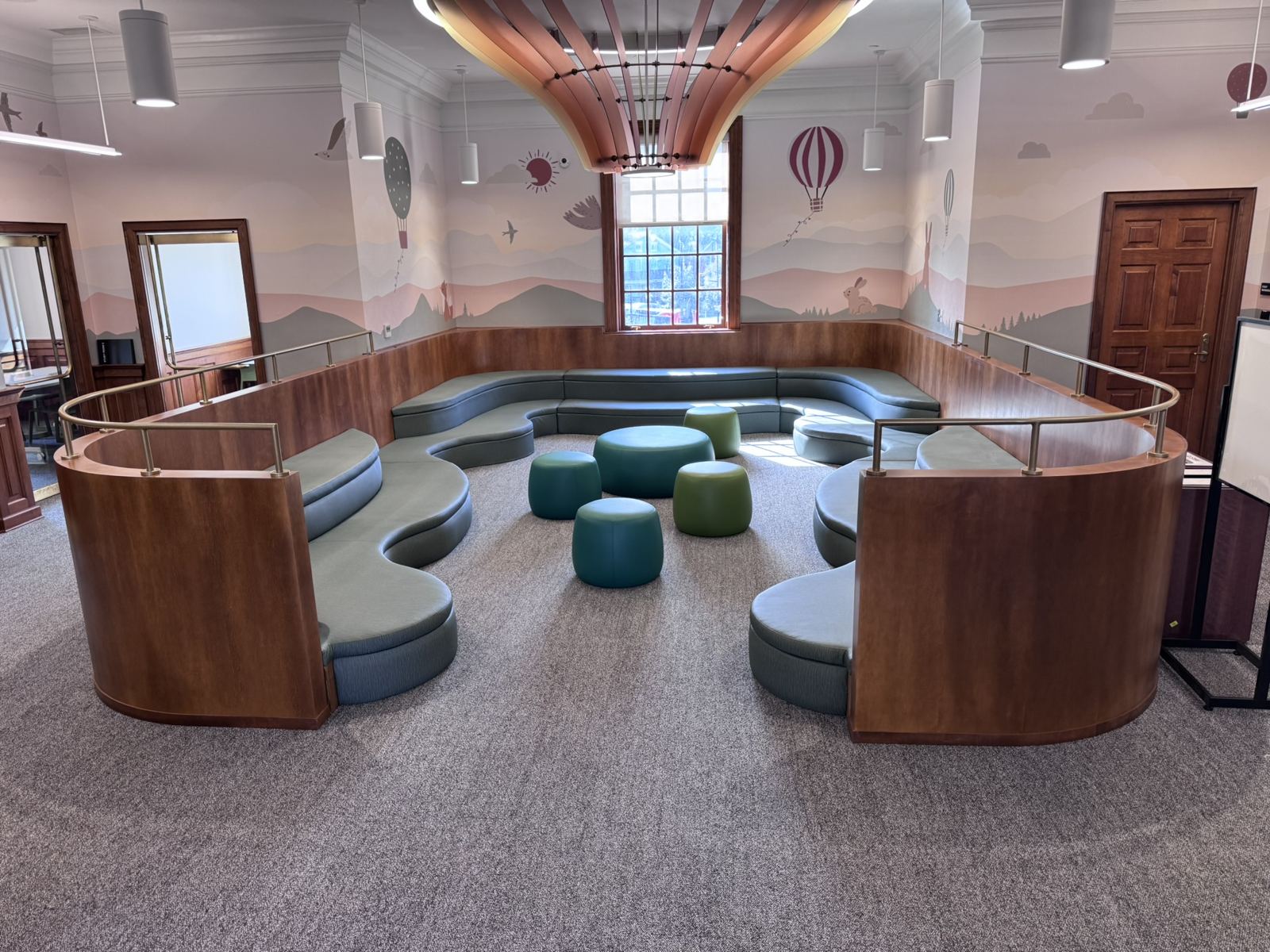 Finished Petworth Neighborhood Library reading center with two-level curved benches and matching cushions by SMFW
